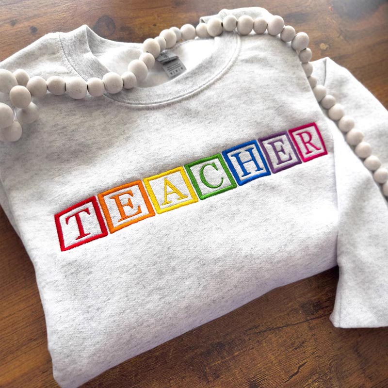 Heather grey high quality embroidered hoodie with monogram detail